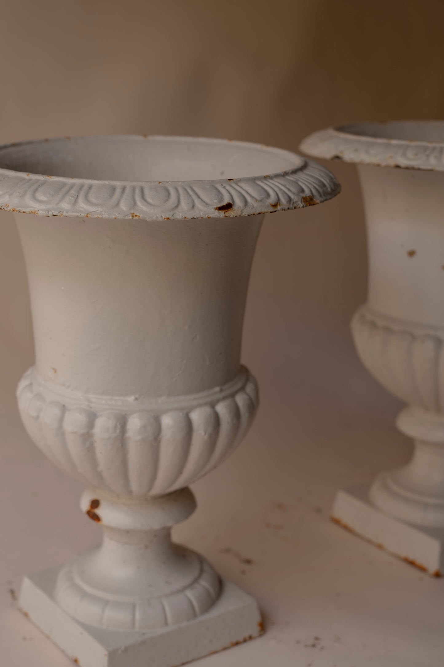 Off white cast iron urn