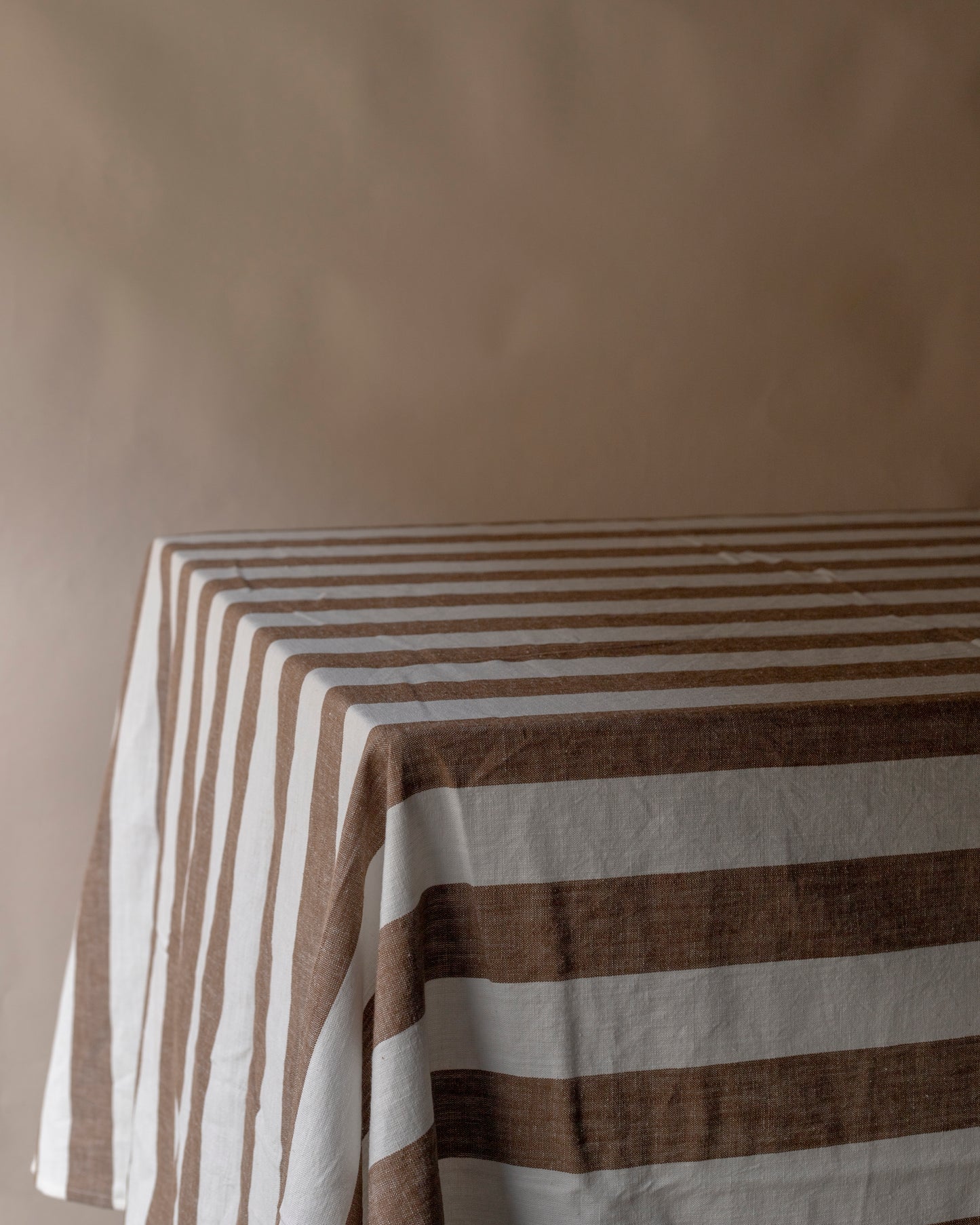 Striped brown and off white table cloth