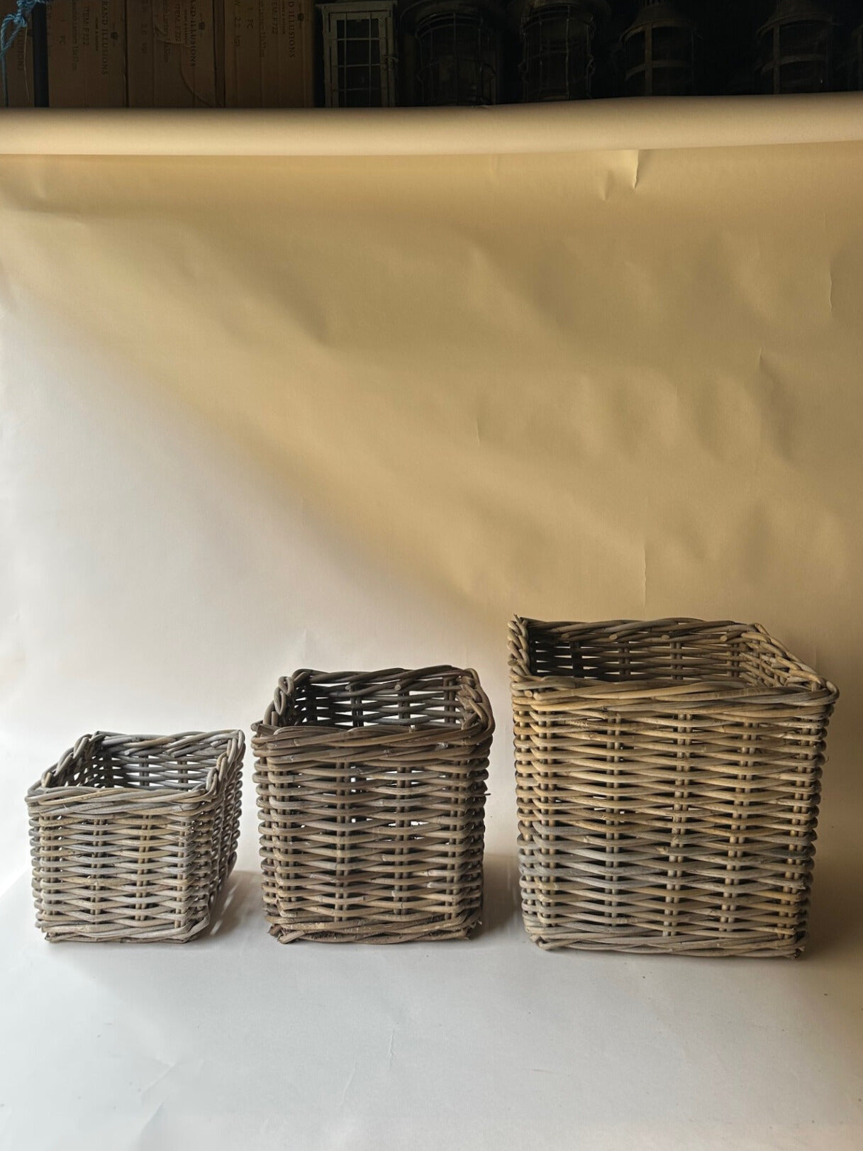 Trio of square wicker baskets