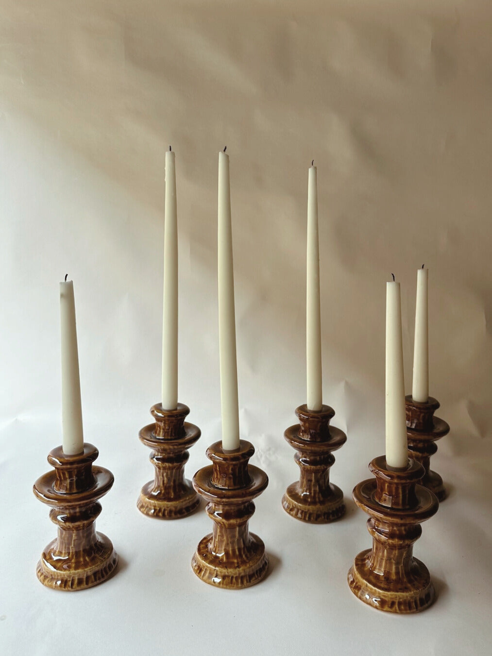 Brown glazed ceramic candlesticks