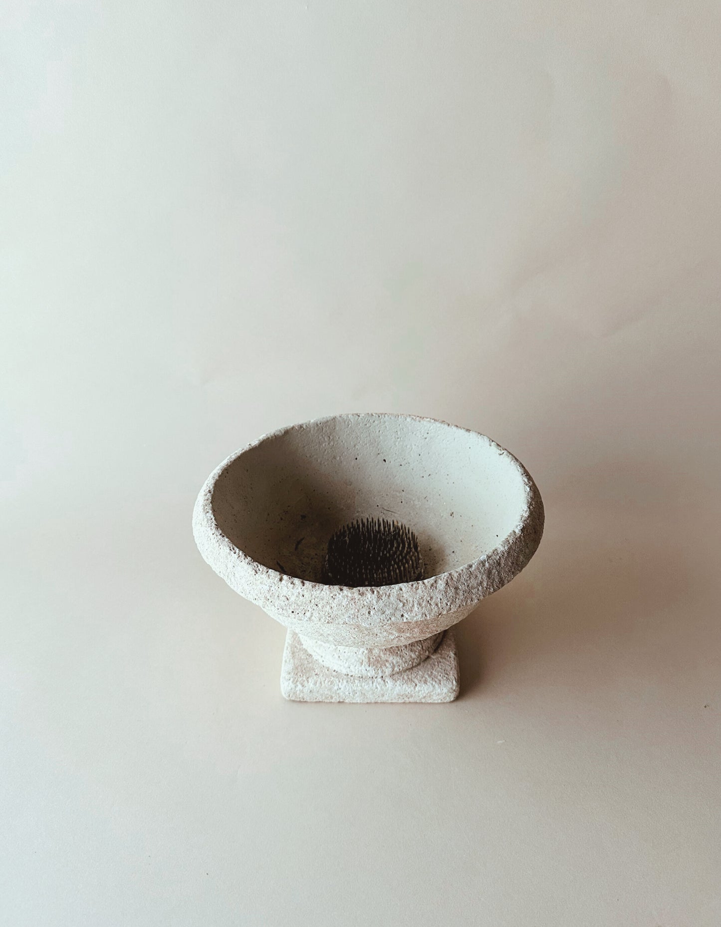 Low table top stone urn