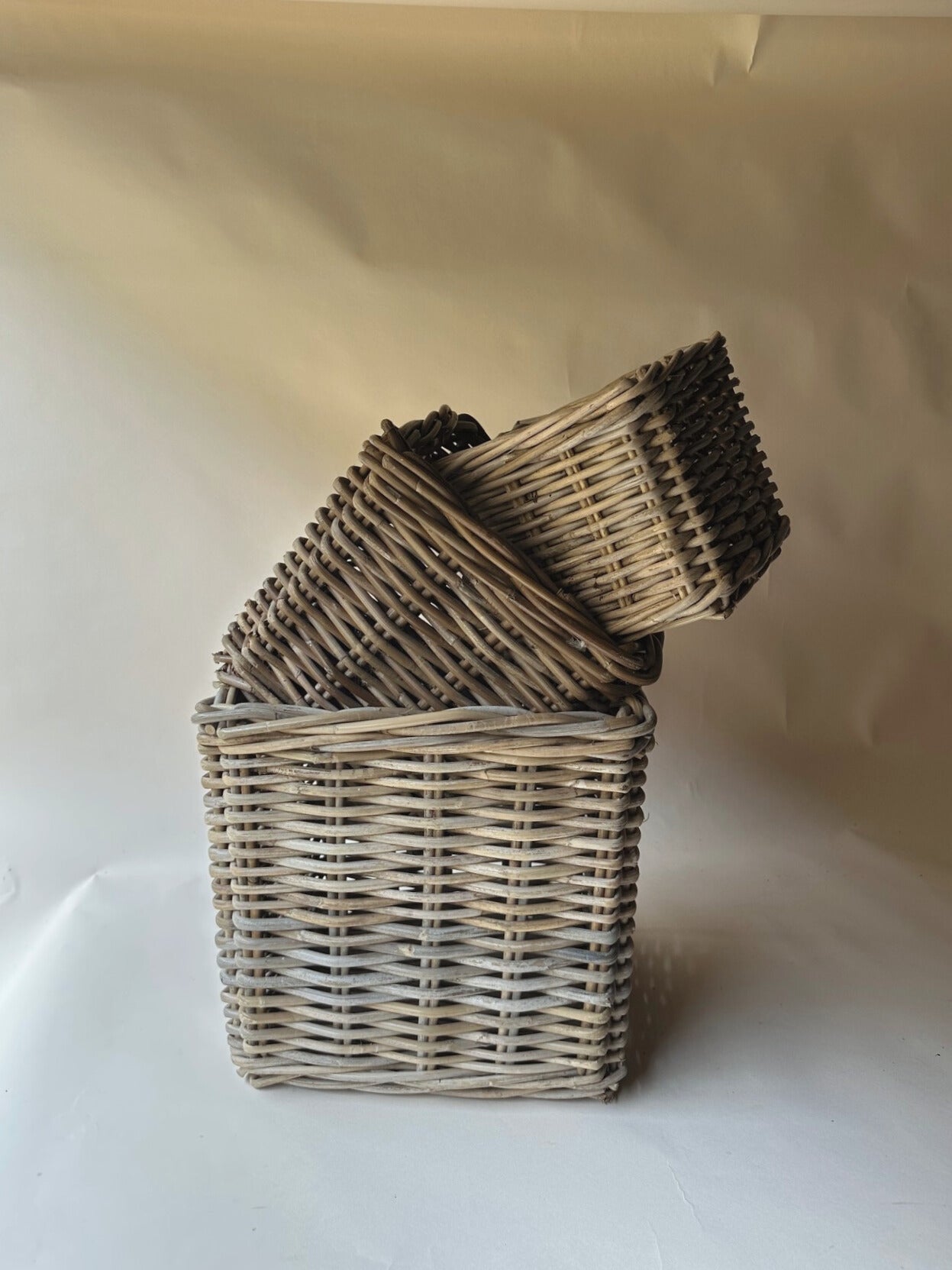 Trio of square wicker baskets