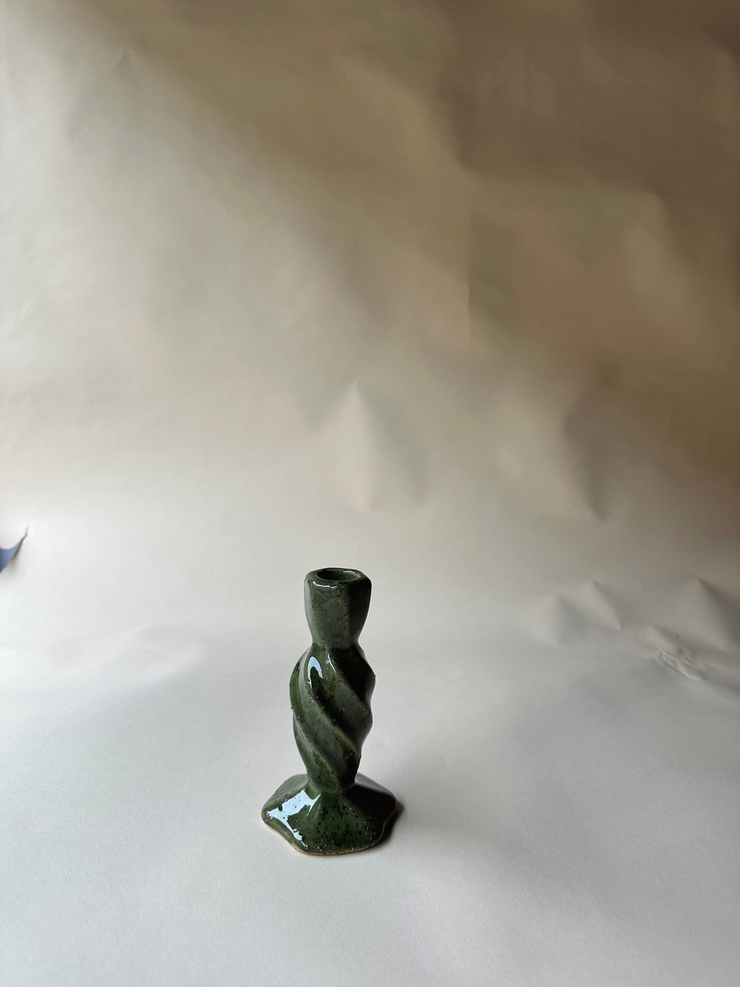Green specked pottery candlesticks
