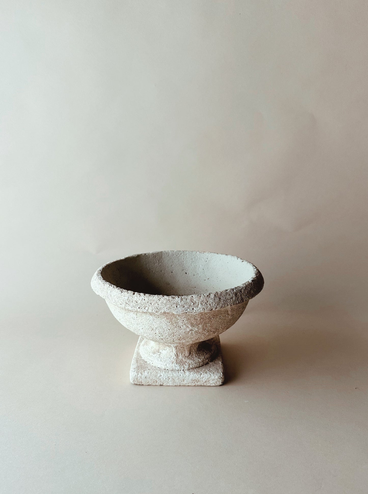 Low table top stone urn