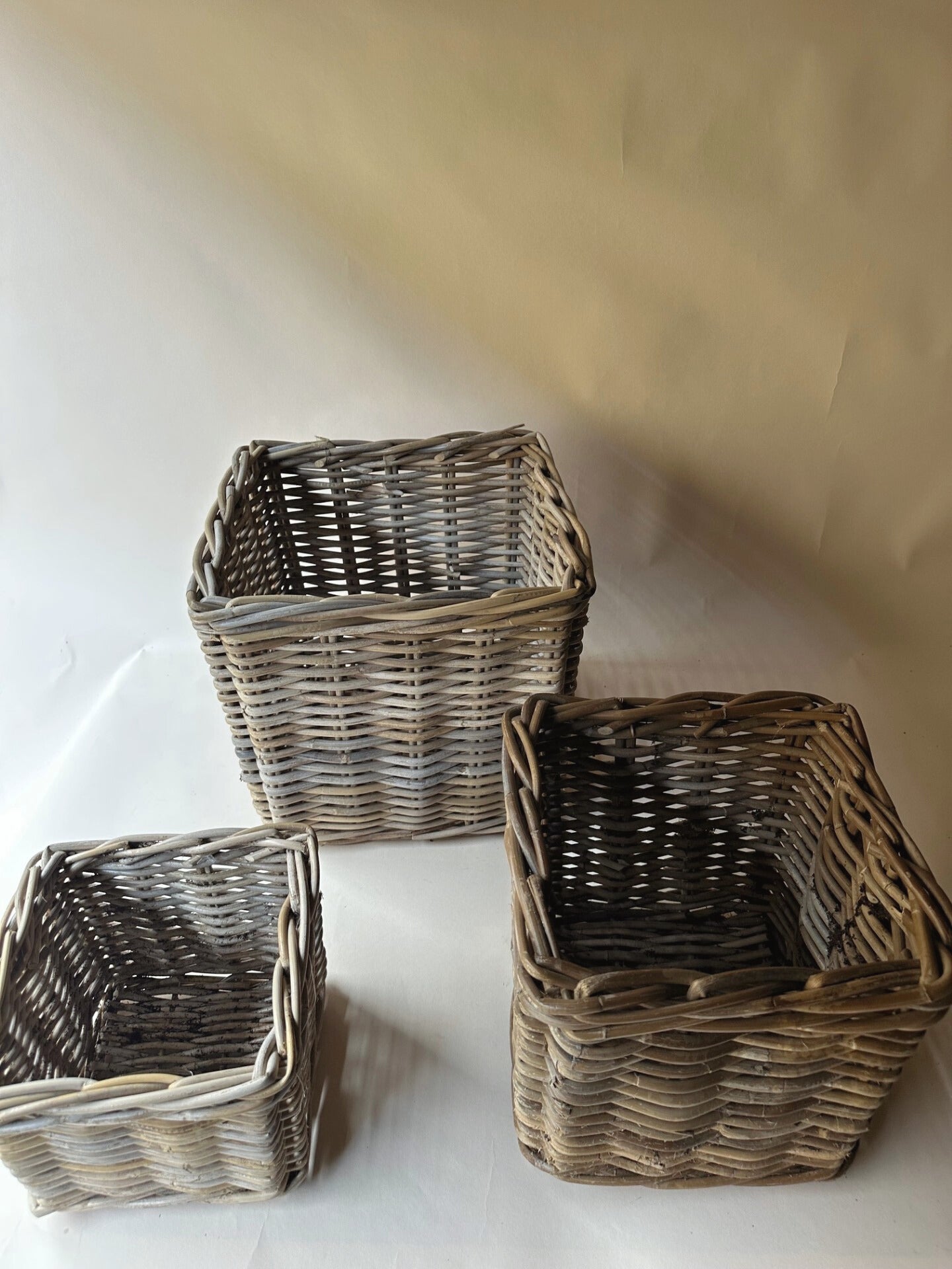 Trio of square wicker baskets