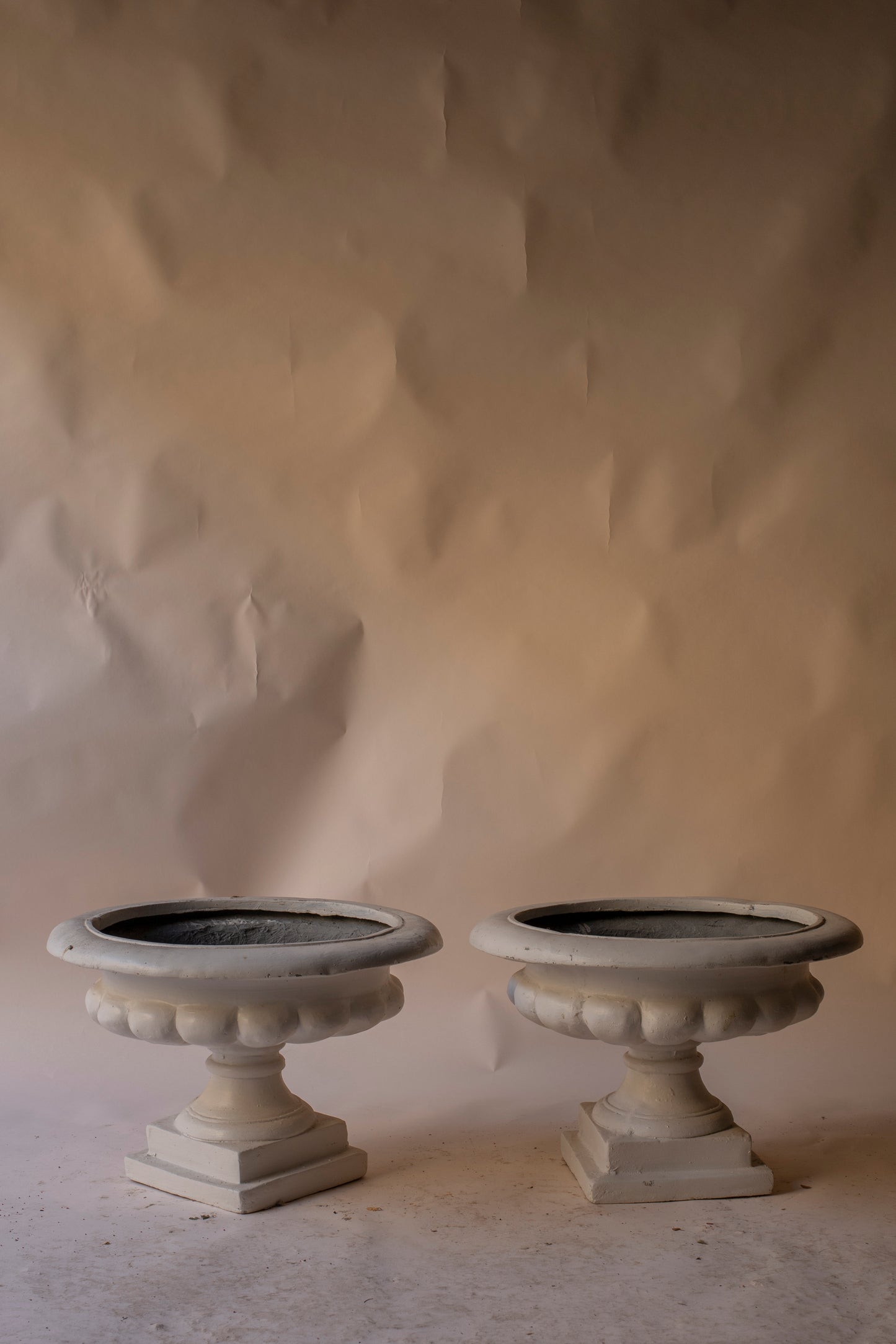 Low off white fibreglass urns
