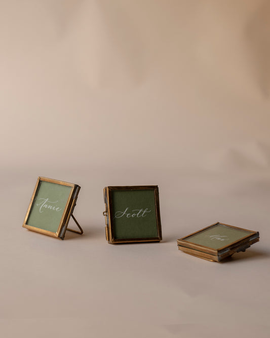 Tiny brass place card frames