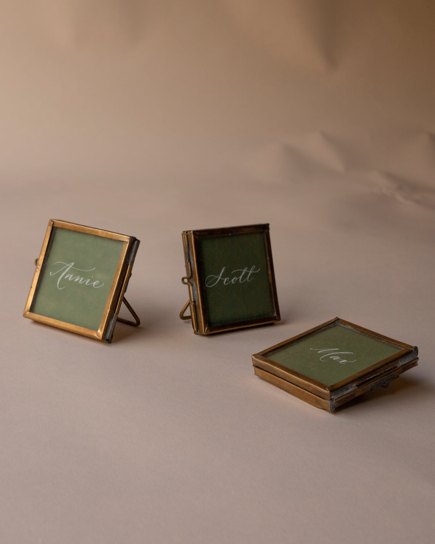 Tiny brass place card frames