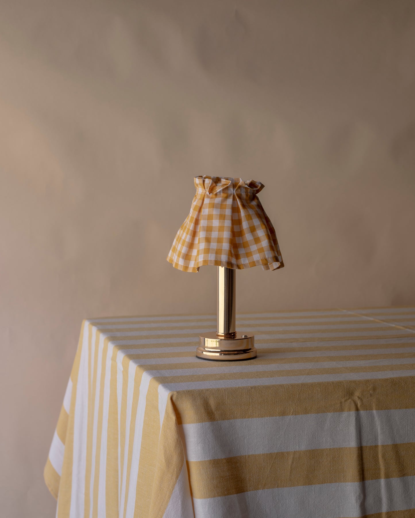 Striped pale yellow table cloth