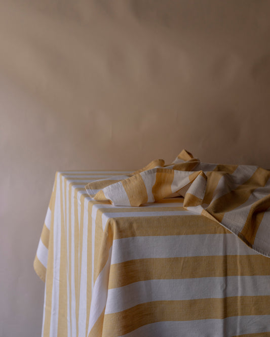 Striped pale yellow table cloth