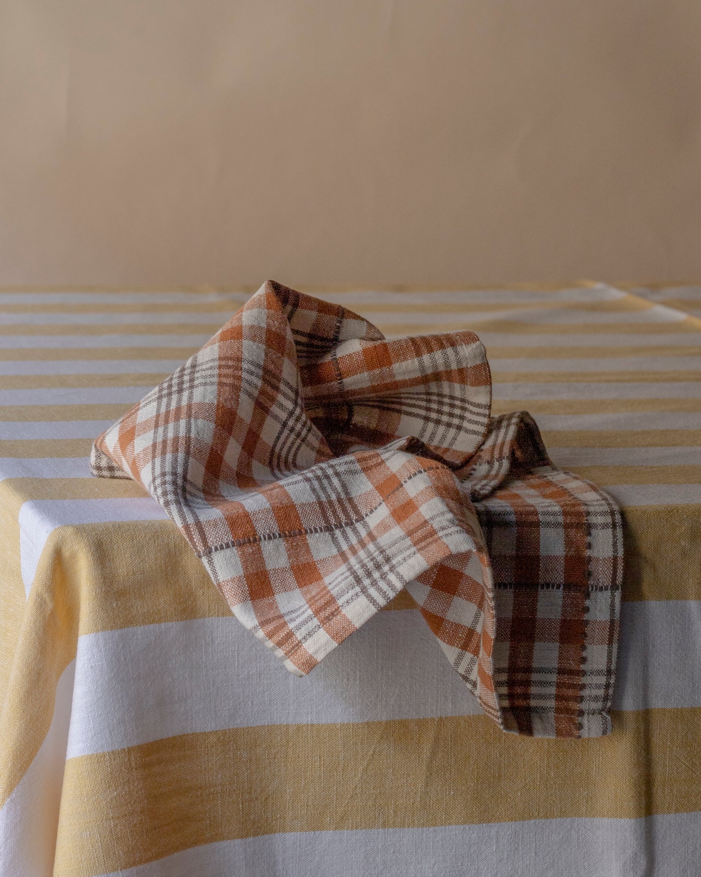 Striped pale yellow table cloth