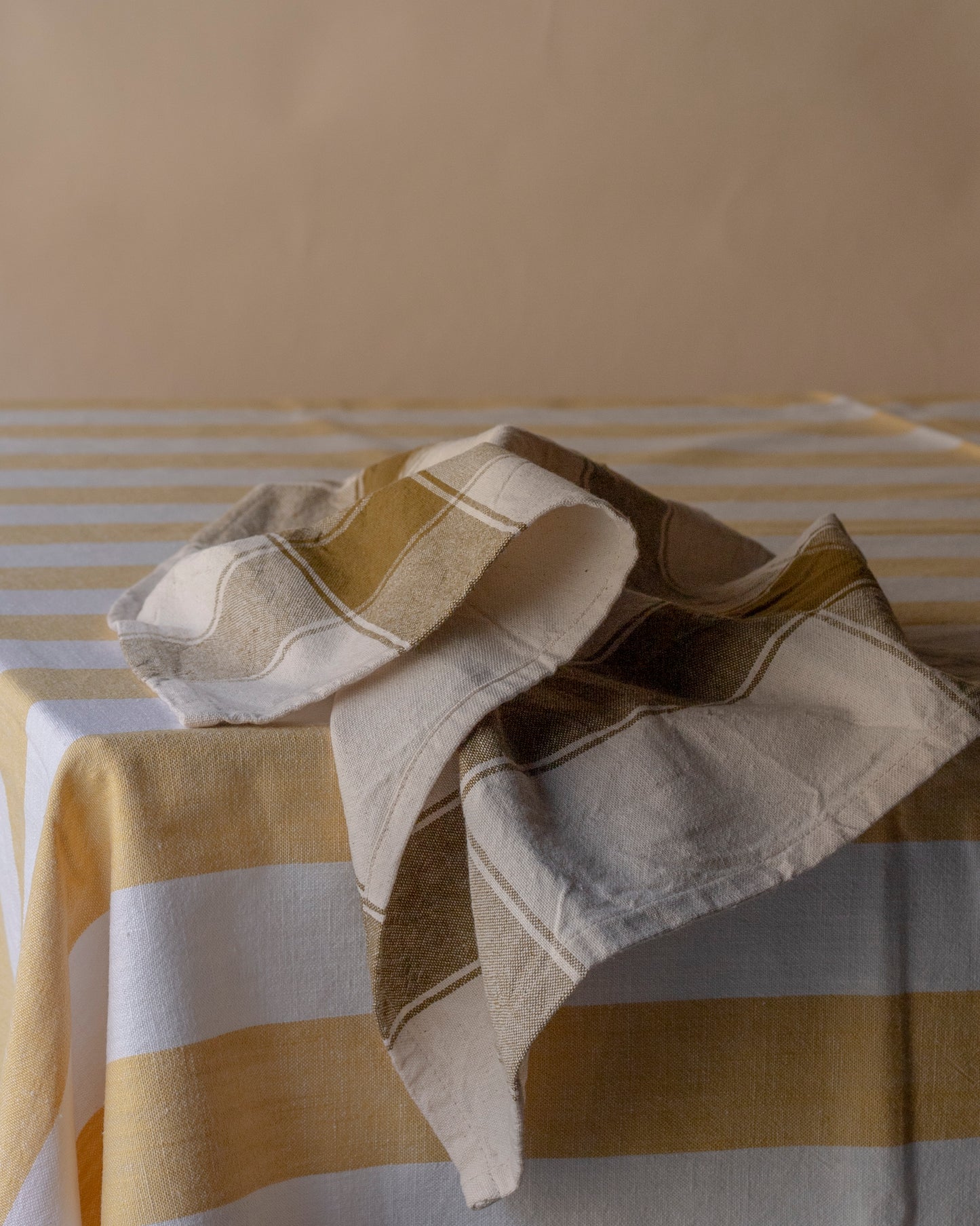 Striped pale yellow table cloth