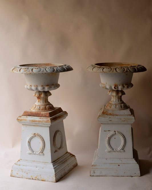 Antique cast iron urn and plinth