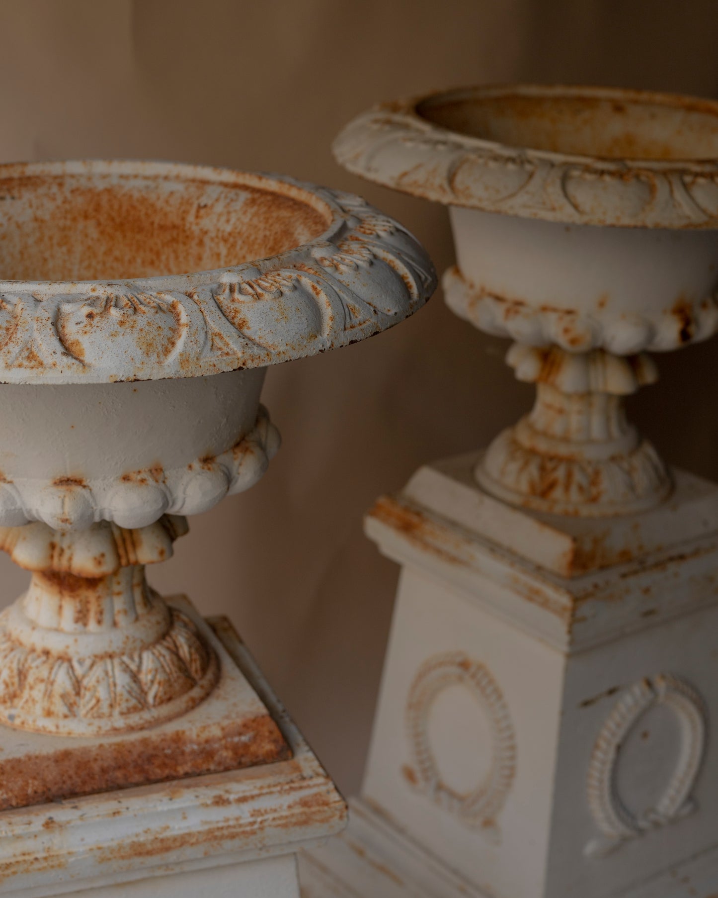 Antique cast iron urn and plinth