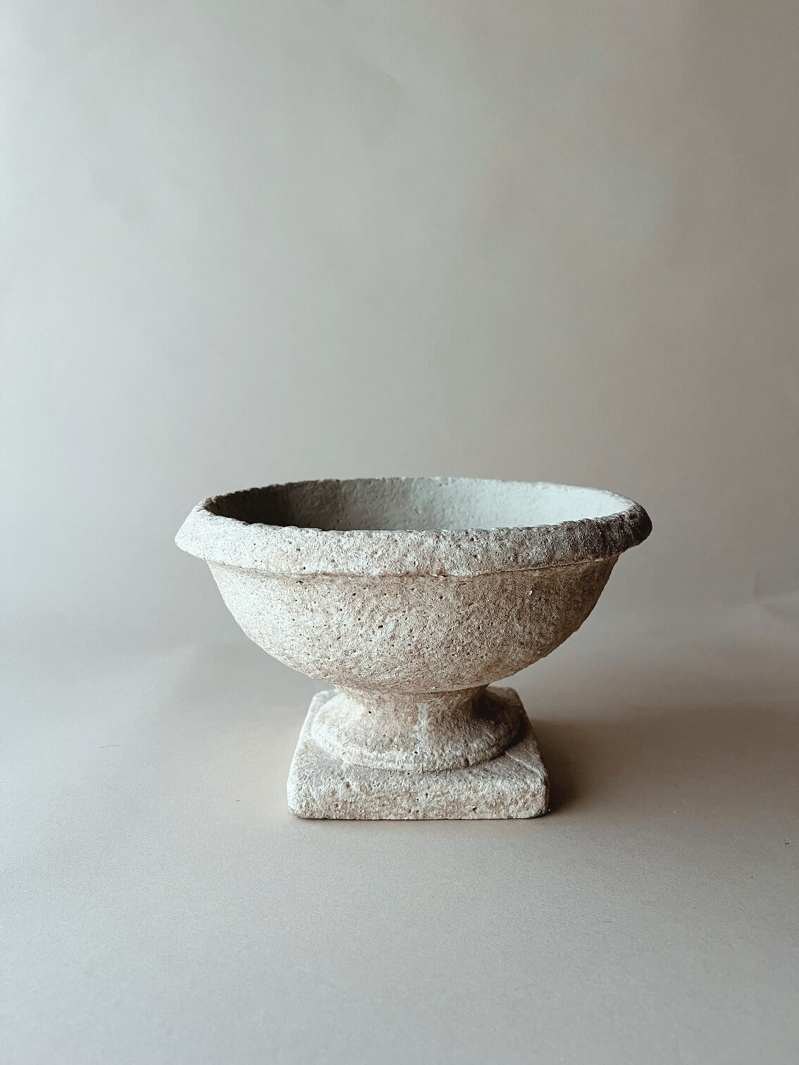 Low table top stone urn