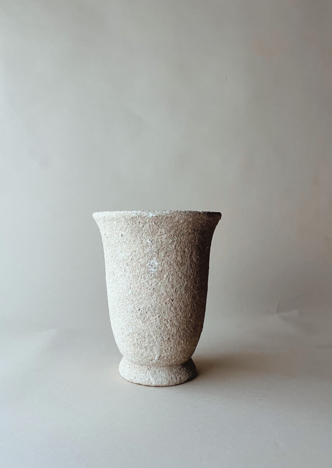 Tall tabletop stone urn