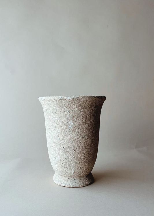 Tall tabletop stone urn