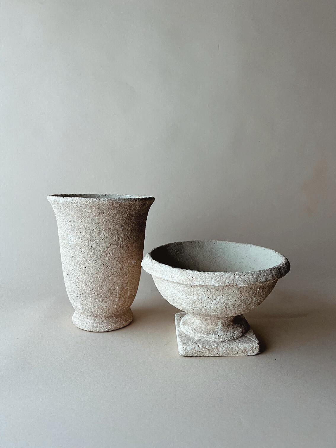 Tall tabletop stone urn