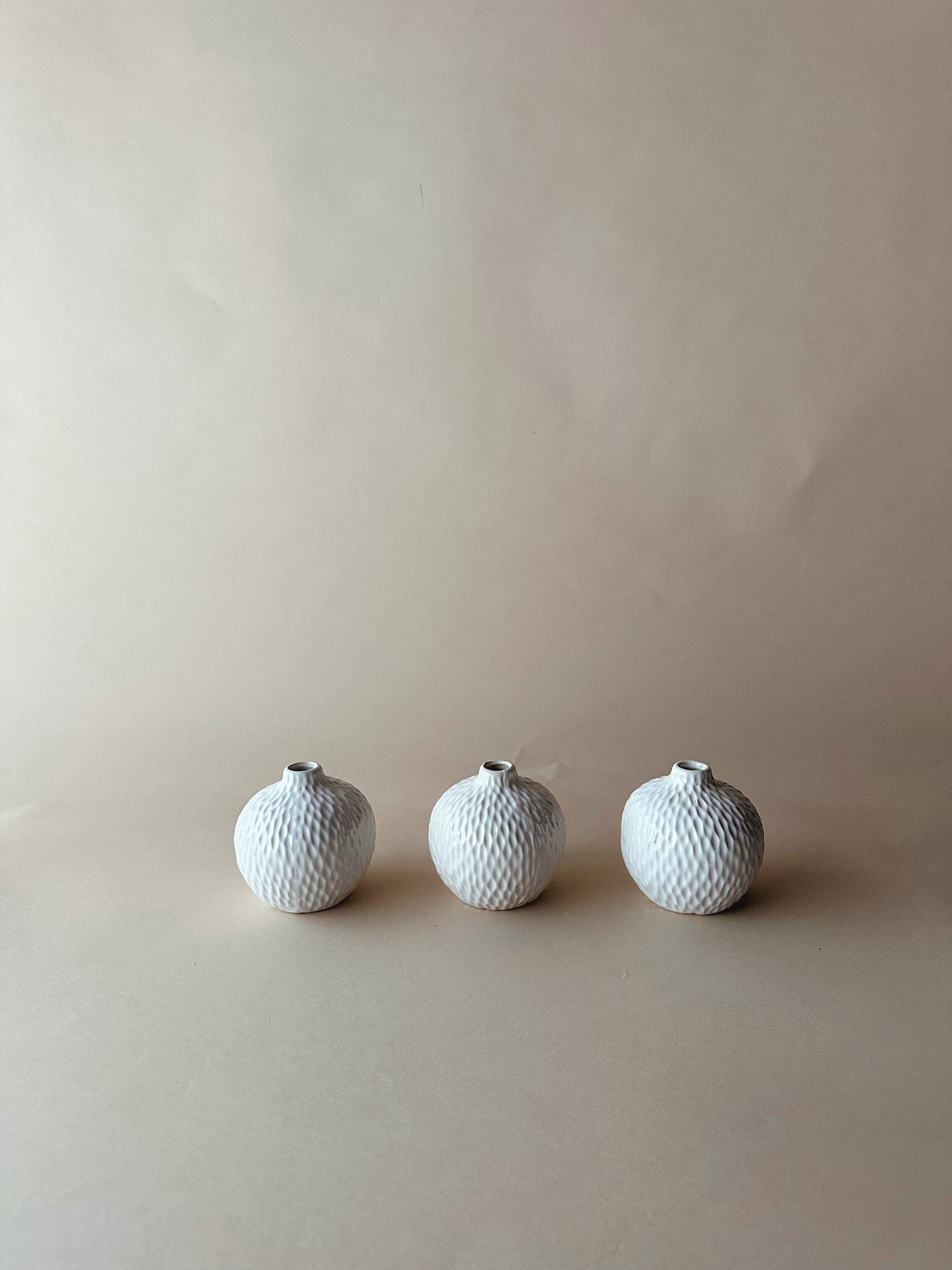 White textured bud vases