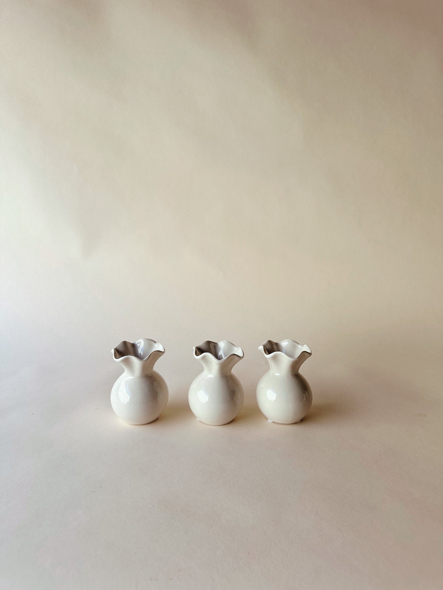 Wavy edged ceramic vases