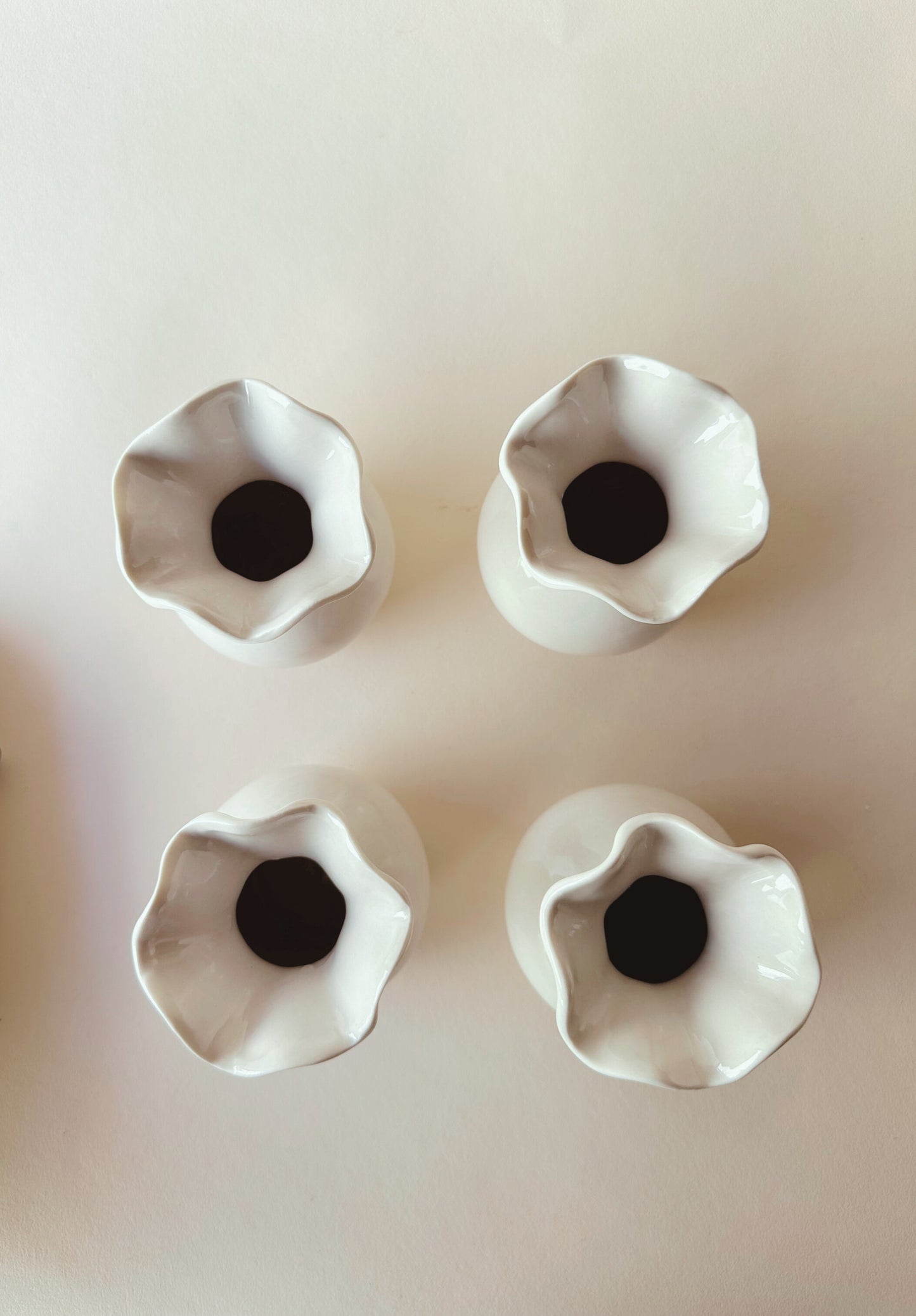 Wavy edged ceramic vases