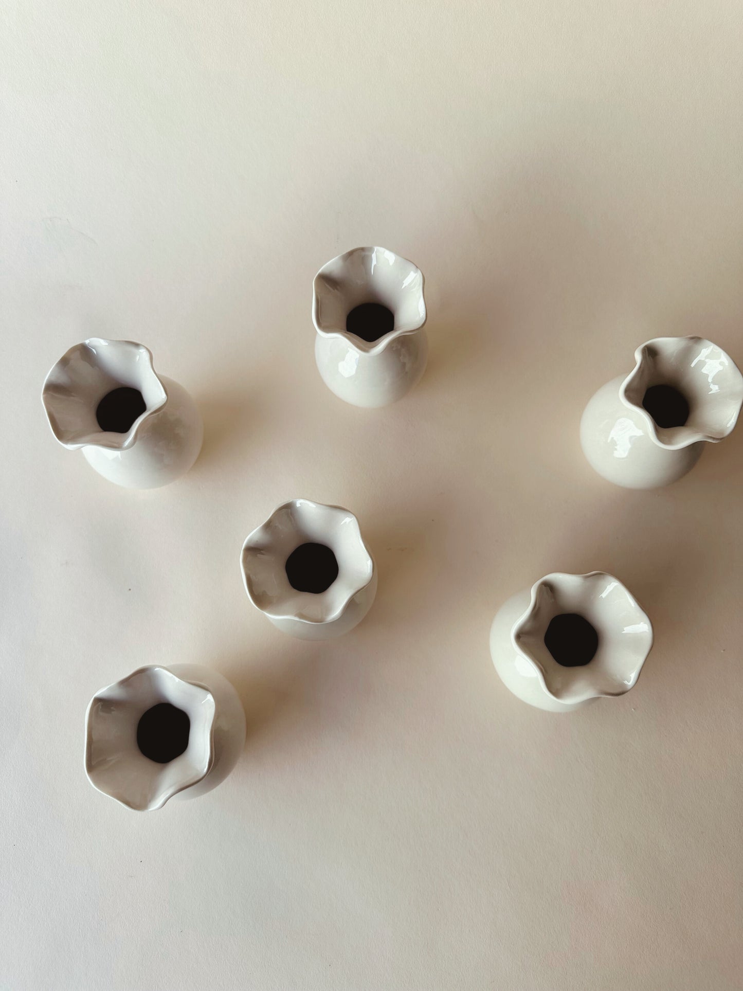 Wavy edged ceramic vases