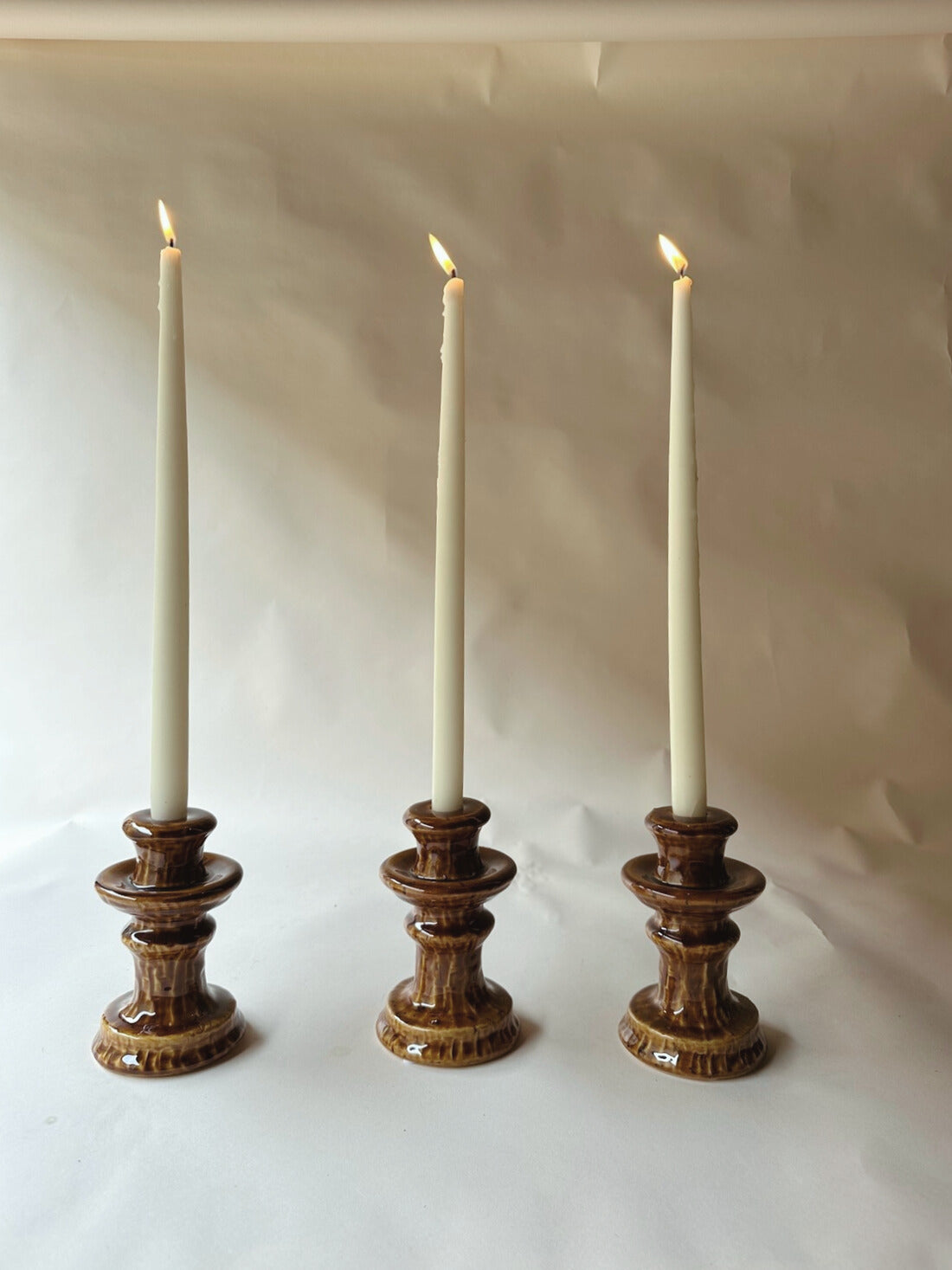 Brown glazed ceramic candlesticks