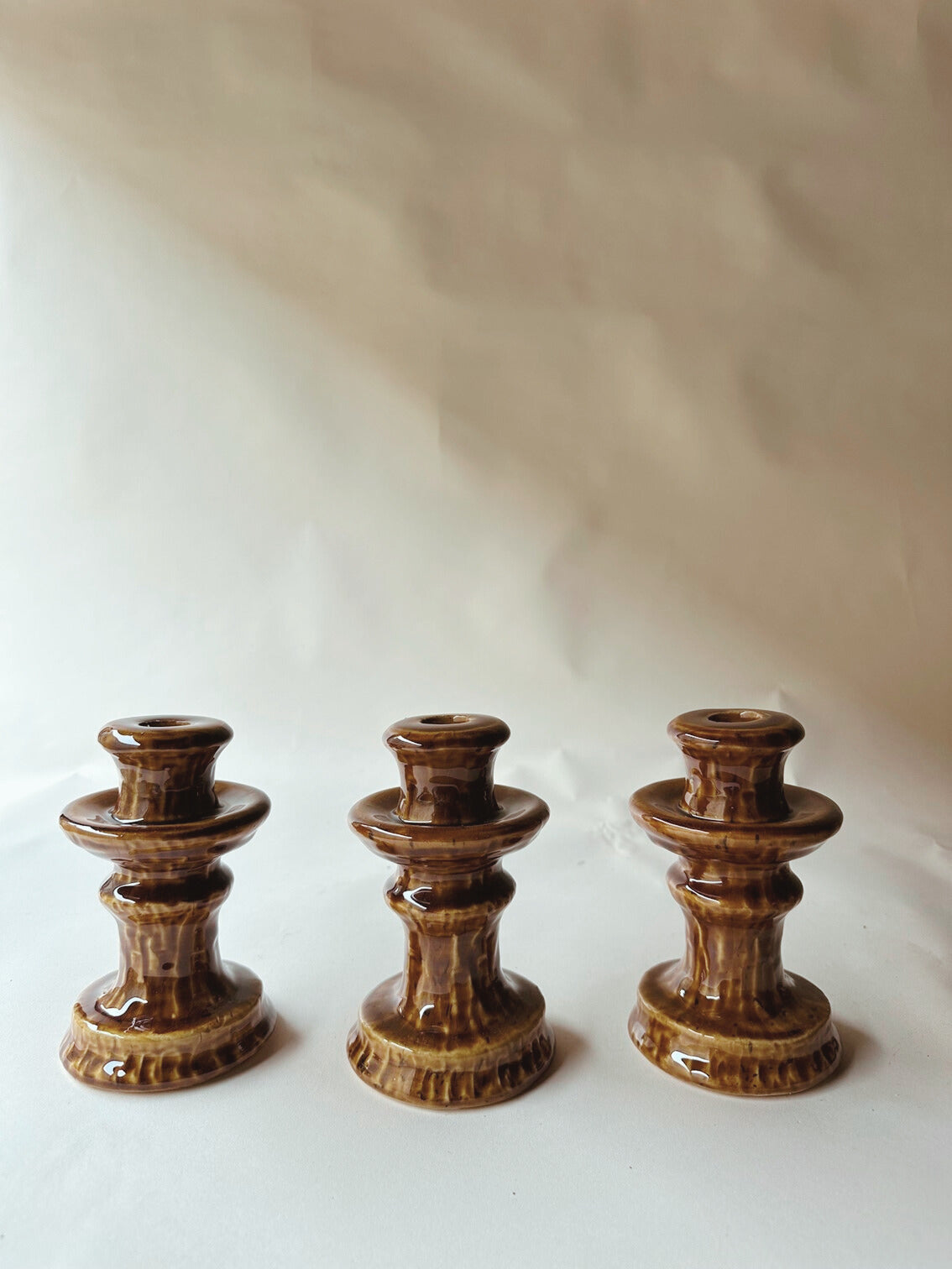 Brown glazed ceramic candlesticks